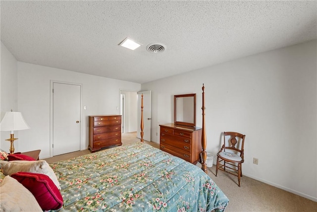 carpeted bedroom with a textured ceiling