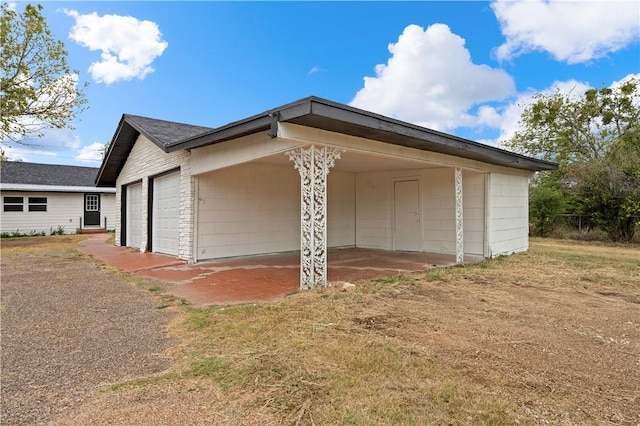 view of side of home with a garage