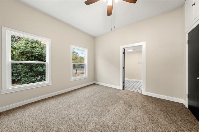 unfurnished bedroom featuring ceiling fan, carpet floors, and a closet