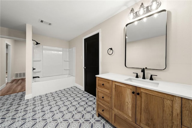 bathroom featuring vanity and tub / shower combination