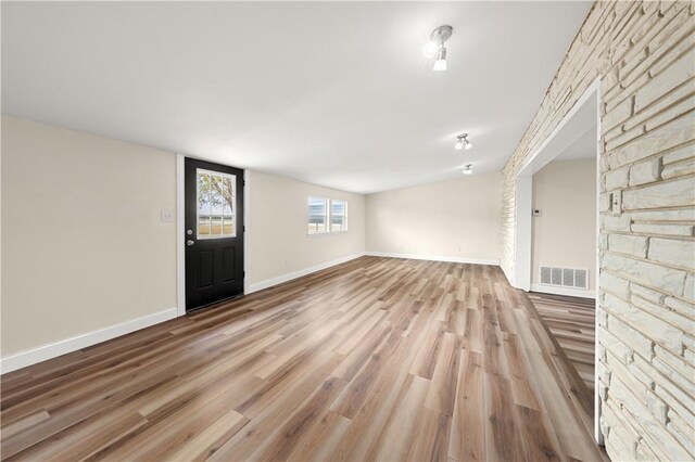 foyer entrance featuring hardwood / wood-style flooring