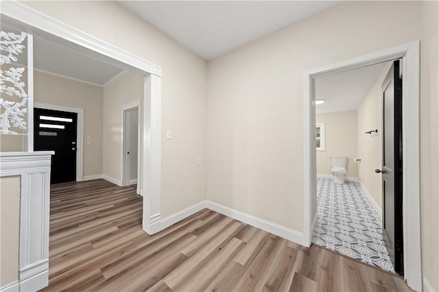 hallway with light wood-type flooring