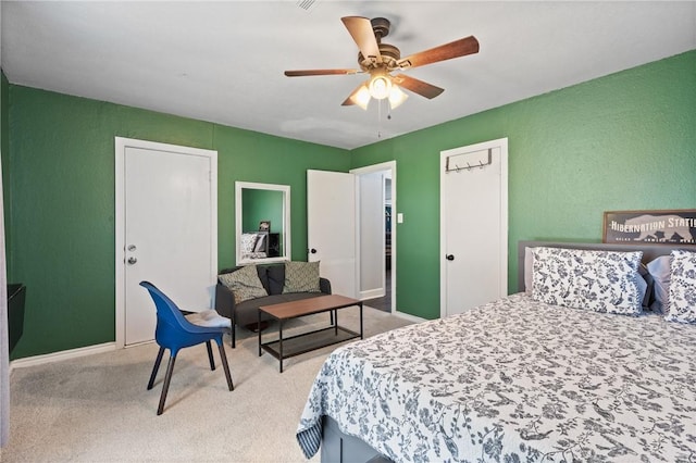 carpeted bedroom with a ceiling fan