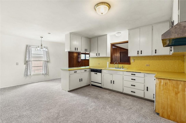 kitchen with dishwasher, hanging light fixtures, a wealth of natural light, and sink