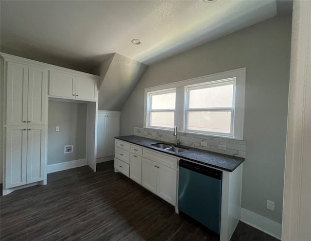 kitchen with sink, dark wood-type flooring, stainless steel dishwasher, lofted ceiling, and white cabinets