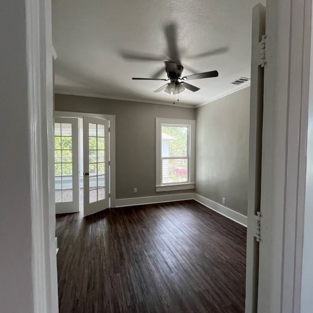 unfurnished room featuring french doors, ceiling fan, ornamental molding, a textured ceiling, and dark hardwood / wood-style flooring