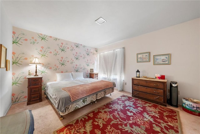 carpeted bedroom featuring wallpapered walls