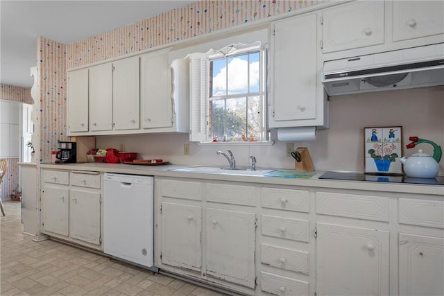 kitchen with black electric stovetop, under cabinet range hood, light countertops, white dishwasher, and a sink