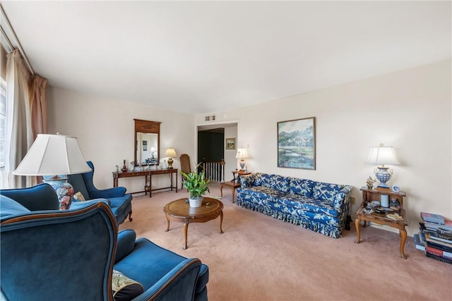 carpeted living area featuring visible vents