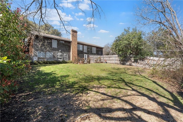 view of yard with fence