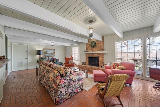 living room featuring plenty of natural light and brick floor