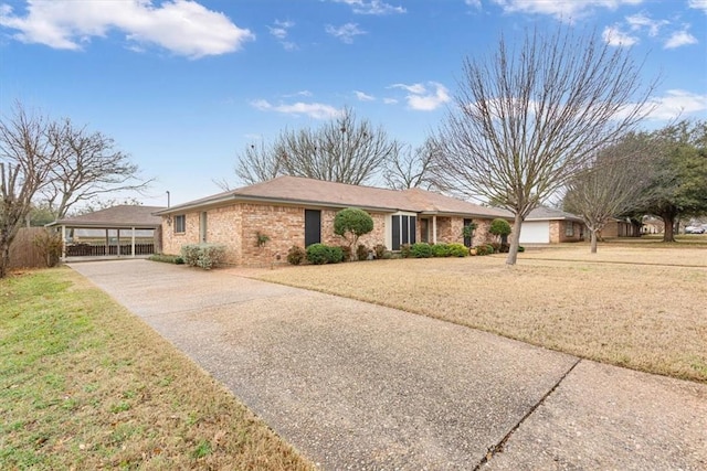 single story home with a carport and a front yard