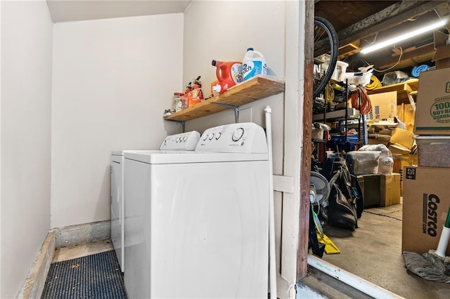 clothes washing area featuring washer and clothes dryer