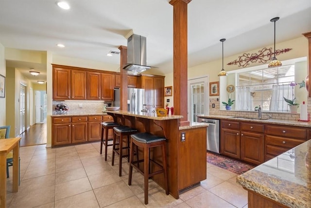 kitchen featuring sink, stainless steel appliances, backsplash, a kitchen island, and exhaust hood