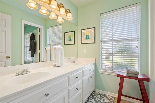 bathroom featuring tile patterned flooring and vanity