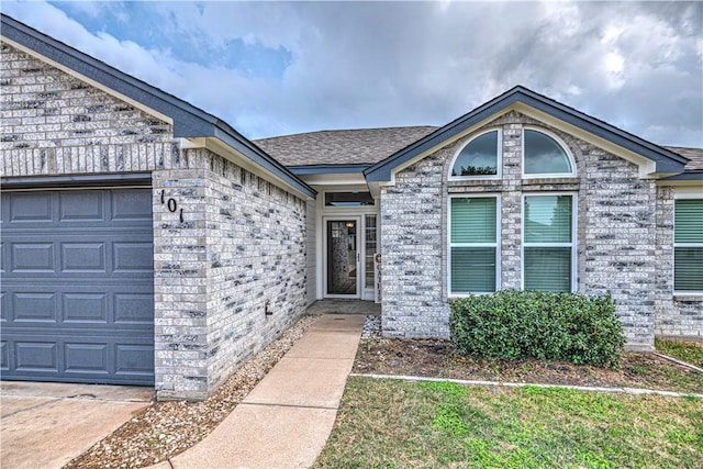 property entrance with a garage