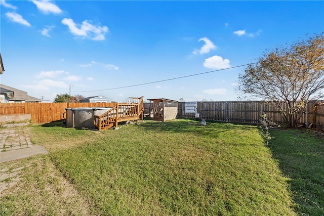 view of yard featuring a swimming pool side deck