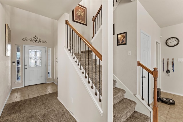 view of carpeted foyer entrance