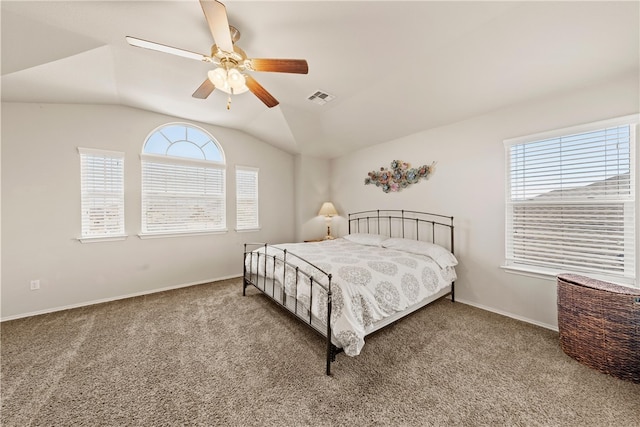 carpeted bedroom featuring ceiling fan and vaulted ceiling