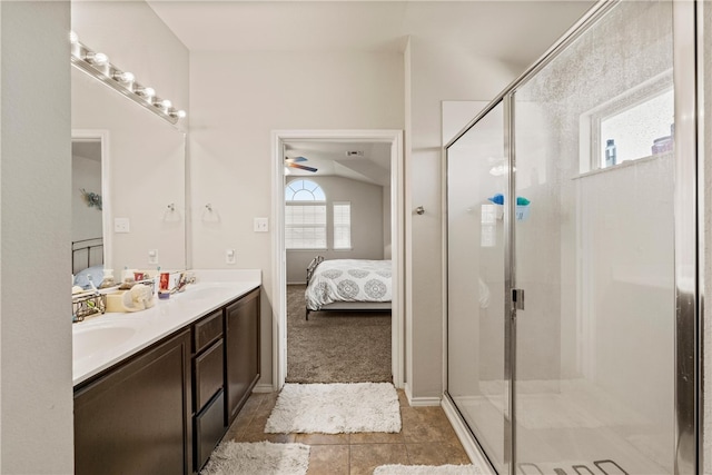 bathroom with a wealth of natural light, vanity, a shower with shower door, and lofted ceiling