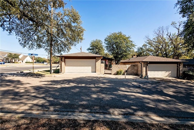 ranch-style house with brick siding and an attached garage