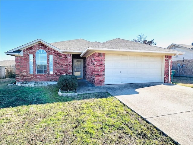 ranch-style house with a garage and a front yard