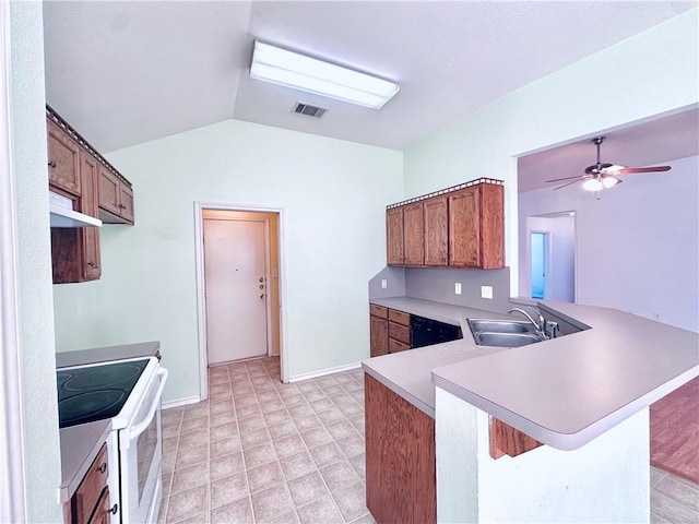 kitchen featuring electric stove, sink, lofted ceiling, a breakfast bar area, and kitchen peninsula