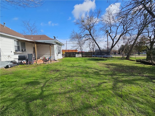 view of yard with a trampoline