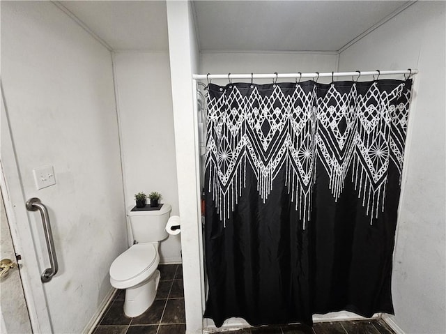 bathroom with tile patterned floors, toilet, and a shower with shower curtain