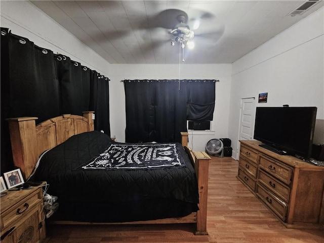 bedroom featuring light hardwood / wood-style flooring and ceiling fan