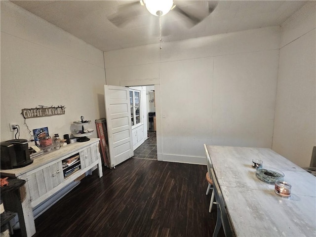 kitchen featuring ceiling fan and dark hardwood / wood-style floors