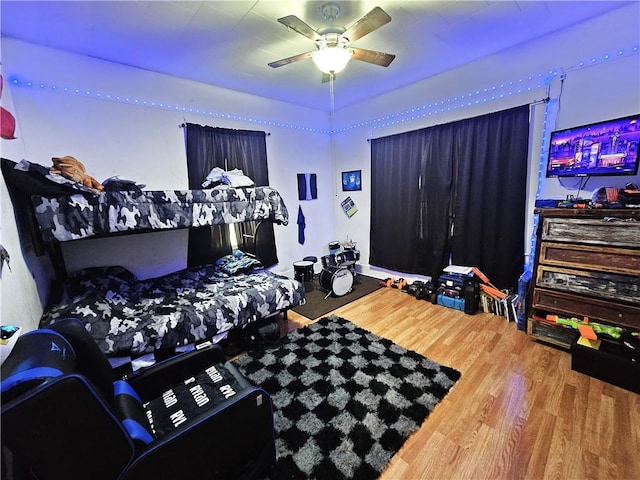 bedroom featuring wood-type flooring and ceiling fan