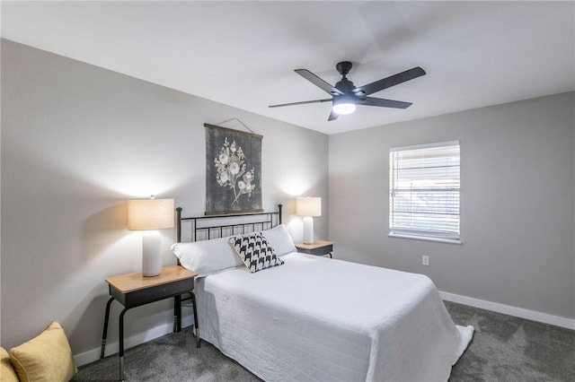 bedroom featuring dark colored carpet and ceiling fan