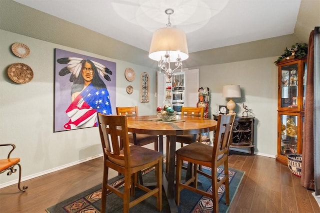 dining space featuring dark hardwood / wood-style floors