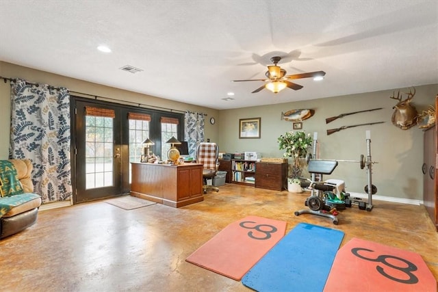 workout area with ceiling fan, french doors, and a textured ceiling