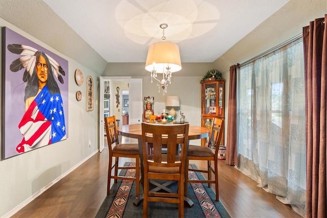 dining room with dark hardwood / wood-style flooring