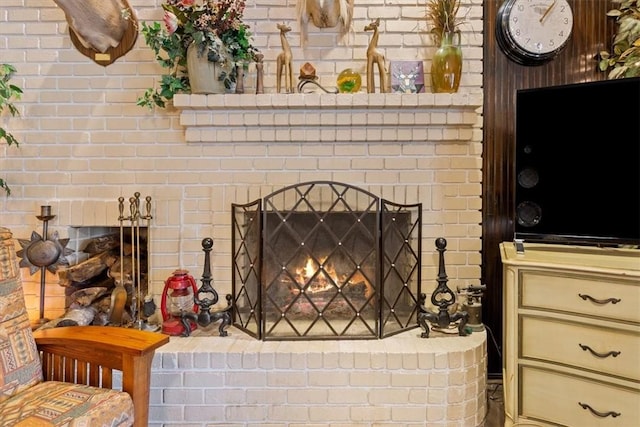 details featuring a brick fireplace