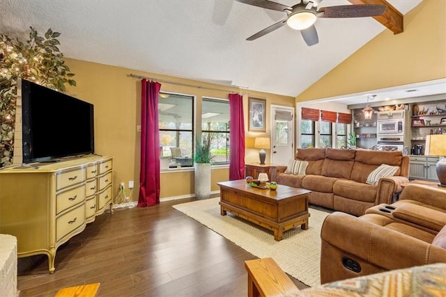 living room with dark hardwood / wood-style floors, a healthy amount of sunlight, lofted ceiling, and ceiling fan