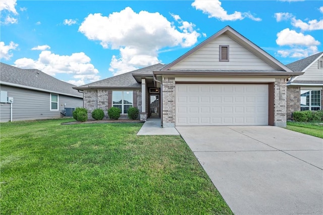 view of front of property featuring a front yard, a garage, and cooling unit