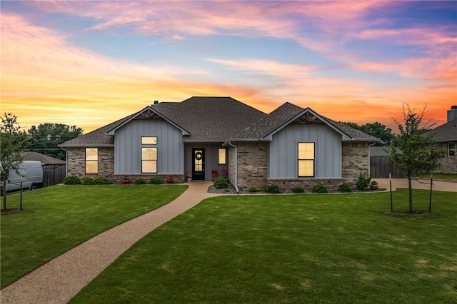 view of front of house with a yard