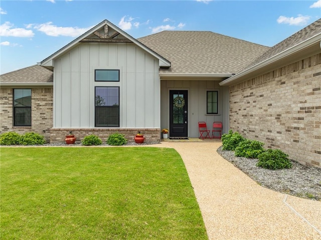 entrance to property with a yard