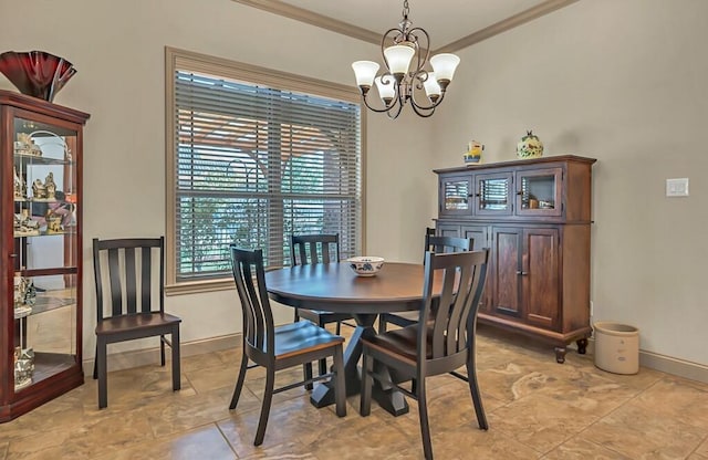 dining room with ornamental molding and a notable chandelier