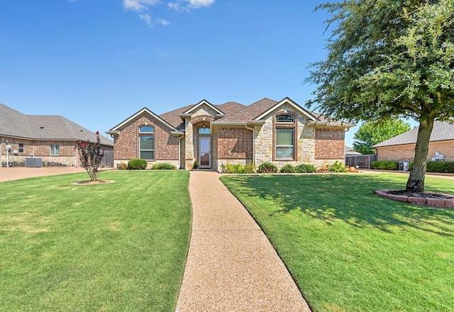 view of front of home featuring central AC unit and a front lawn