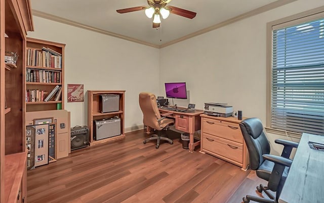 office area featuring ceiling fan, crown molding, and dark wood-type flooring