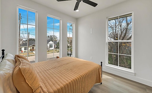 bedroom featuring ceiling fan and light hardwood / wood-style floors