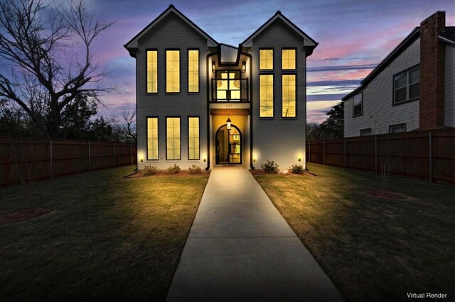 view of front of property with a lawn