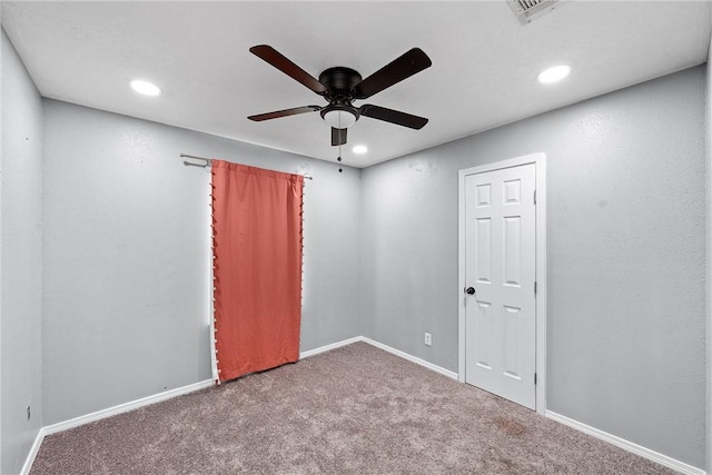 carpeted empty room with ceiling fan