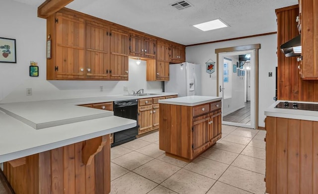 kitchen with light tile patterned flooring, a center island, ornamental molding, kitchen peninsula, and black appliances