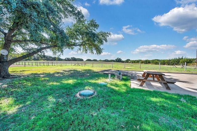 exterior space with a lawn and a rural view