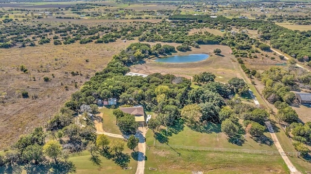 birds eye view of property with a rural view and a water view